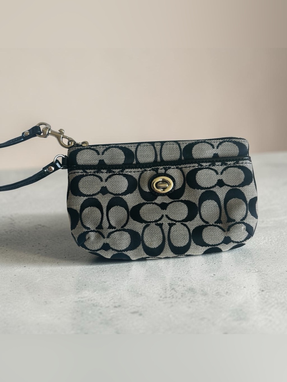 Coach Black and Cream Signature Turn-Lock Wristlet